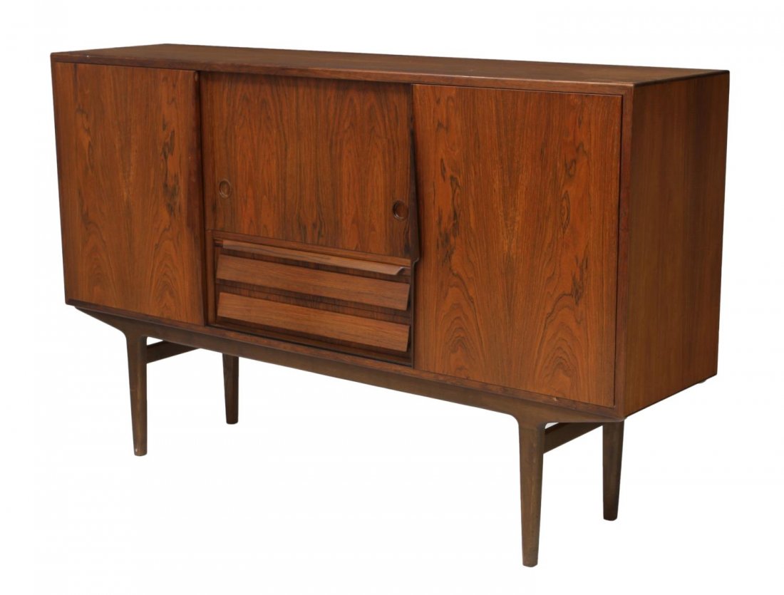 DANISH MID-CENTURY MODERN ROSEWOOD SIDEBOARD: Danish mid-century modern rosewood sideboard, c. 1950's / 1960's, the long rectangular top over sliding doors and central drawers, nicely fitted interior with open shelving and pull out tray drawers, 