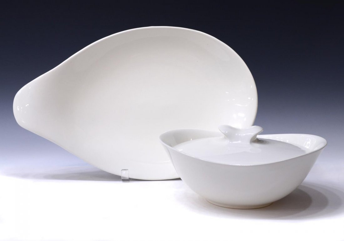 (2) EVA ZEISEL HALLCRAFT MID-CENTURY SERVICEWARE: (lot of 2) Mid-century Hallcraft porcelain serving ware, shape design by Eva Zeisel, comprising: (1) side handle oval platter, 17.25"l, 11"w; (1) covered dish, 4"h, 10.25"l, 8"w; each marked on base,