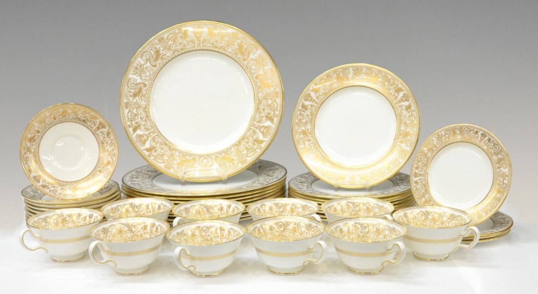 (43) WEDGWOOD GOLD FLORENTINE DINNER SERVICE: (lot of 43) Wedgwood bone china dinner service in "Gold Florentine" pattern, each having gilt dragon and bird running motif, comprising: (10) dinner plates, 10.75"diam; (9) salad plates, 8"diam; (4) b