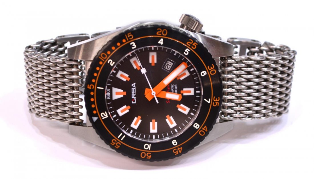 ORSA SEA VIPER DIVER WATCH, SHARK MESH BAND: Orsa Sea Viper diver wrist watch, black dial with orange and white markers, date window at 4 o'clock, silver tone metal shark mesh band, back retaining plastic cover, approx case: 2.25"h, 2"w, interio