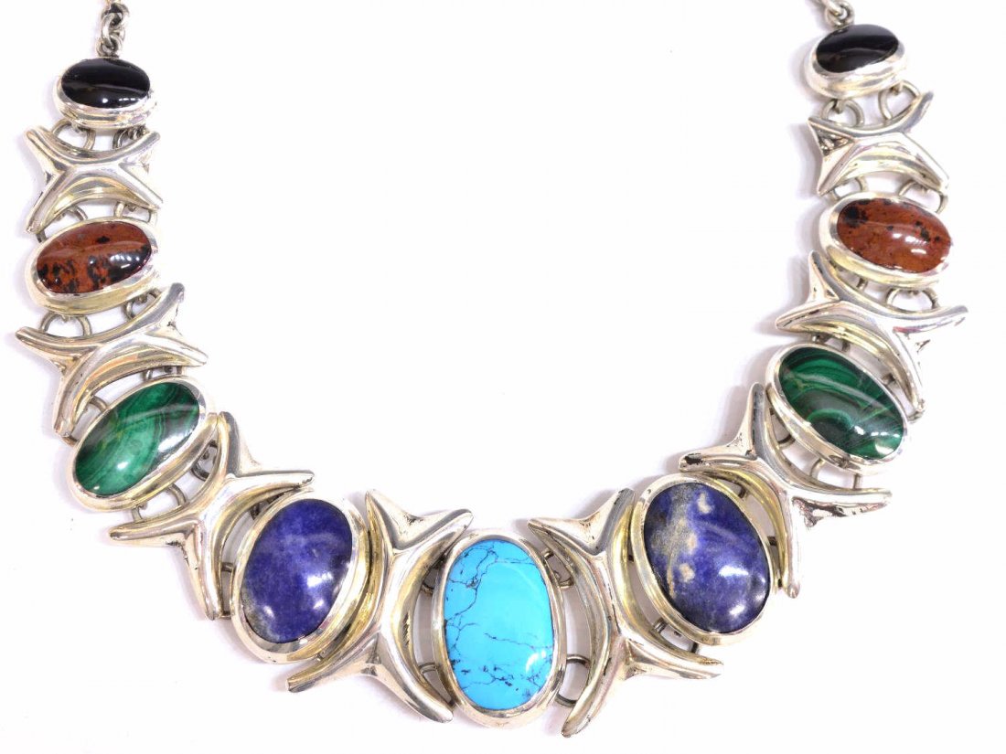 HEAVY & FINE MEXICO SILVER MULTI-STONE NECKALCE: Heavy silver necklace, Mexico, turquoise, sodalite, malachite, brown stone with black, and onyx cabochons set in oval silver frame, spaced by stylized X's, approx 20"l, 197 grams (inclusive of all mat