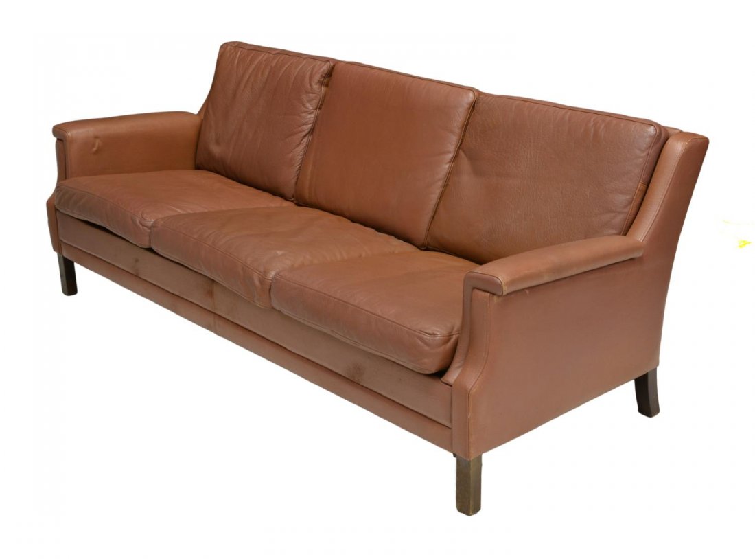 DANISH MID-CENTURY MODERN BROWN LEATHER SOFA: Danish mid-century modern brown leather sofa, removable back and seat cushions, rising on square feet, surface wear to base, approx 27.5"h, 71"w, 28.5"d Start Price: $250.00