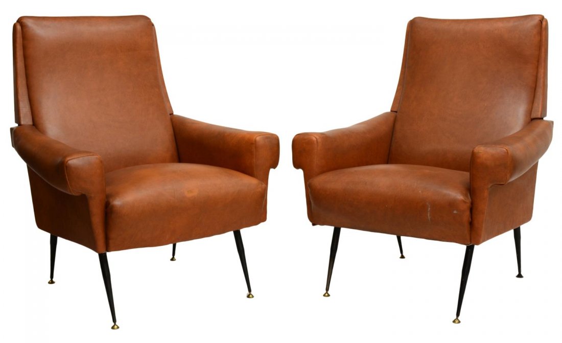 (2)ITALIAN MID-CENTURY MODERN TAN ARMCHAIRS: (pair) Italian mid-century modern armchairs, c. 1960, brown vinyl upholstered chairs with nail head trim rising on black enamel iron tapered legs, approx 36.5"h, 29"w, 28"d Start Price: $400.00