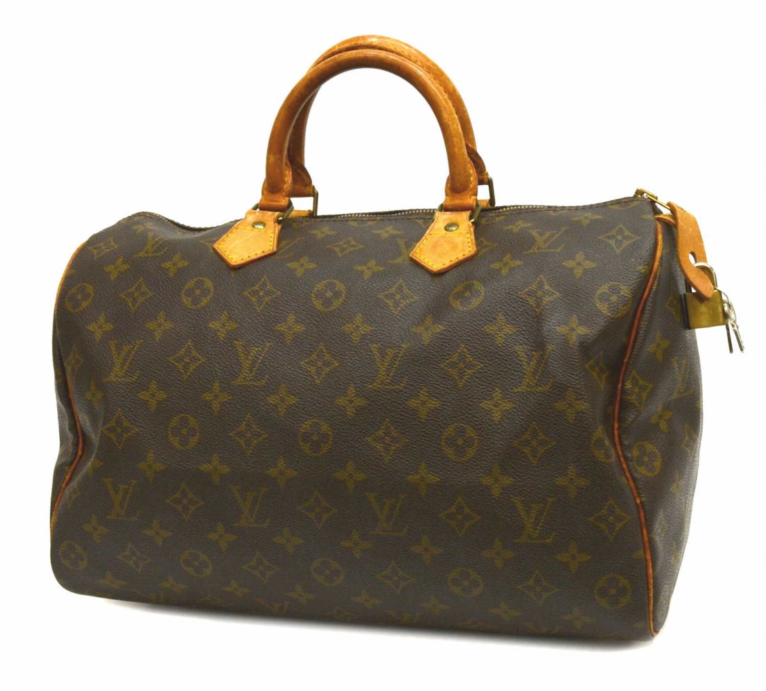 LOUIS VUITTON SPEEDY 35 MONOGRAM HANDBAG: Louis Vuitton "Speedy 35" handbag in monogram canvas, leather handles, piping and trim, single zipper opening to slot pocket, retaining lock and keys, some wear to leather, bag: approx 9"h, 14"w, 7.5"