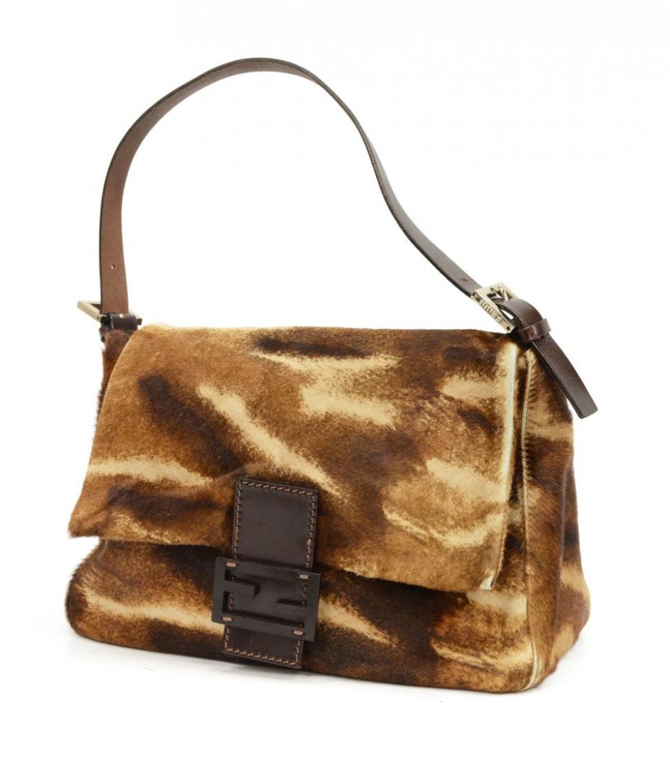 FENDI BROWN CALF HAIR MAMA BAGUETTE BAG: Fendi 'Mamma' baguette shoulder bag in brown calf hair and leather with silver tone hardware, brown canvas interior with one side zipper pocket, single flap with magnetic snap closure, wear to bottom