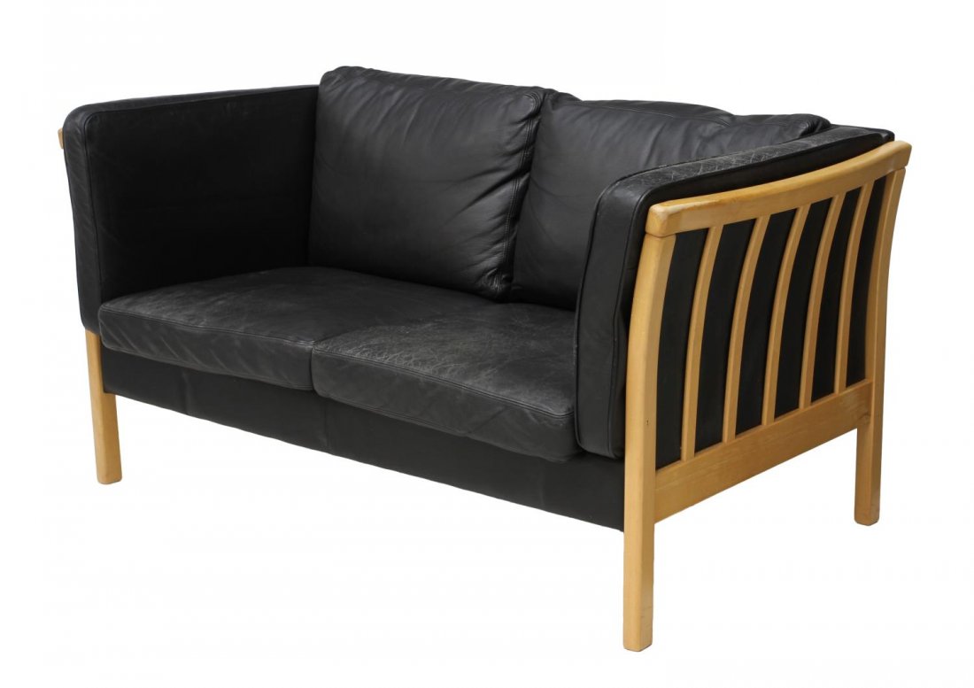 DANISH MID-CENTURY BLACK LEATHER LOVESEAT: Danish mid-century modern loveseat, c. 1950\'s / 1960\'s, Stouby Furniture, black leather upholstery raised on slatted sides, some wear to leather, approx 29\"h, 56\"w, 32\"d