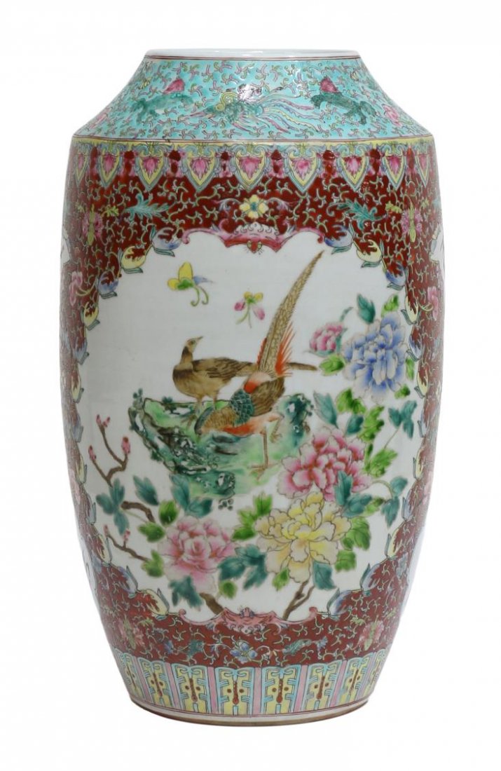 CHINESE ENAMELED FAMILLE ROSE PORCELAIN VASE: Chinese famille rose enameled porcelain vase, tapered neck having a blue ground decorated with foo lion and bird ornamentation, ruyi banding, scrolled tendrils and flowers on the red ground, reserved