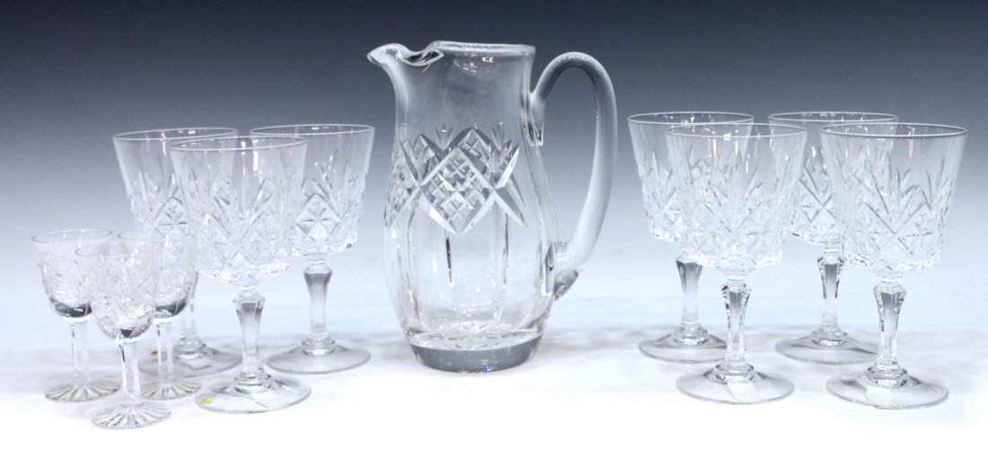(11) WATERFORD & OTHER CUT CRYSTAL TABLEWARE: (lot of 11) Collection of cut crystal drinkware, comprising: (1) Waterford martini pitcher, vertical and cross cut body, ice lip, approx 7.25"h; (3) Waterford "Clare" cordial glasses, approx 3.5"h; ac
