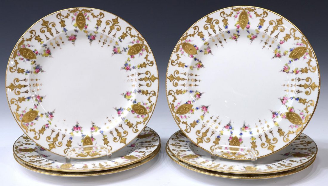 (6) ROYAL CROWN DERBY GILDED FLORAL SERVICE PLATES: (lot of 6) English Royal Crown Derby porcelain service plates, retailed by Richard Briggs Co Boston, floral swags with raised gilt scroll and medallion motif on a white ground, each with maker and ret