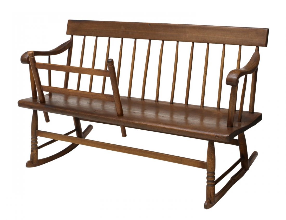 AMERICAN OAK MAMMY'S BENCH: American pine and poplar Mammy's Bench, 19th c., a rocking bench with removable child rail, the spindle supported straight back flanked by arms, rising on turned supports attached to rockers, 28.75"h,