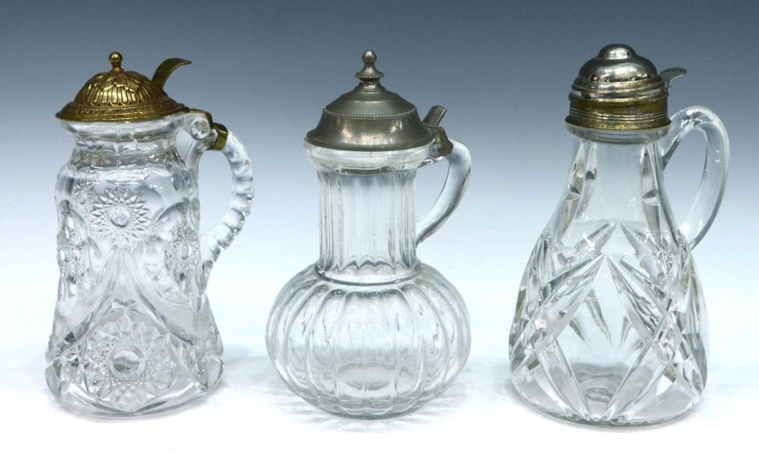 (3) LATE 19TH C. PRESSED GLASS SYRUP PITCHERS (1 of 4)