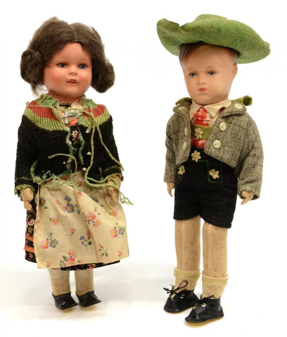 (2) ANTIQUE BLACK FOREST HANSEL & GRETEL DOLLS: (lot of 2) Antique Black Forest Hansel and Gretel dolls, each having composite heads with painted features, straw filled cloth bodies, comprising: (1) boy wearing lederhosen and hat, minor paint loss