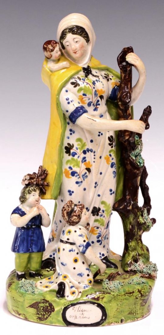 STAFFORDSHIRE PEARLWARE, WIDOW & ORPHAN, LATE 18TH: Staffordshire pearlware group, Widow and Orphan, late 18th c., loss to branch, paint loss, approx 11"h, 2.25 lbs *Provenance: Estate of Howard Hand (Texas, New York, 1921-2011). A collector and seller