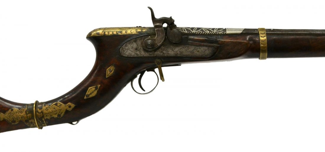 FANCY ANTIQUE NORTH AFRICA 'CAMEL GUN': Antique percussion 'Camel Gun', North Africa, first half 19th c., 36" octagonal barrel, estimated .50 caliber, embellished decoration including character writing at barrel top, Koftgari silver inlay a