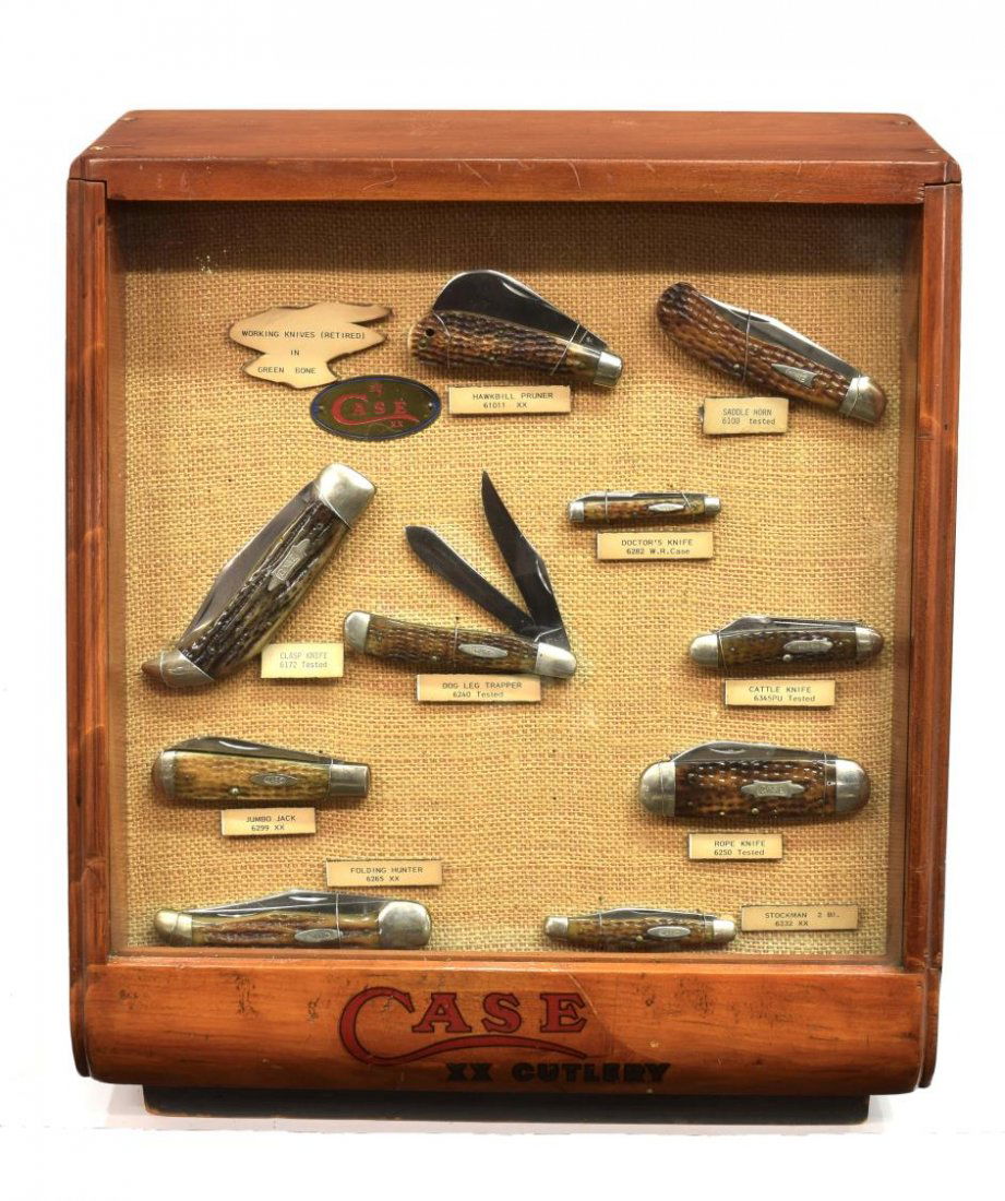 CASE XX DISPLAY & 10 GREEN BONE KNIVES, TESTED: (lot of 11) Case XX Cutlery display with vintage Case knives, the display cabinet with slant glass front opening at the back, retaining a 1959 inventory record from Elliott Hardware, Waldron, Arkansas