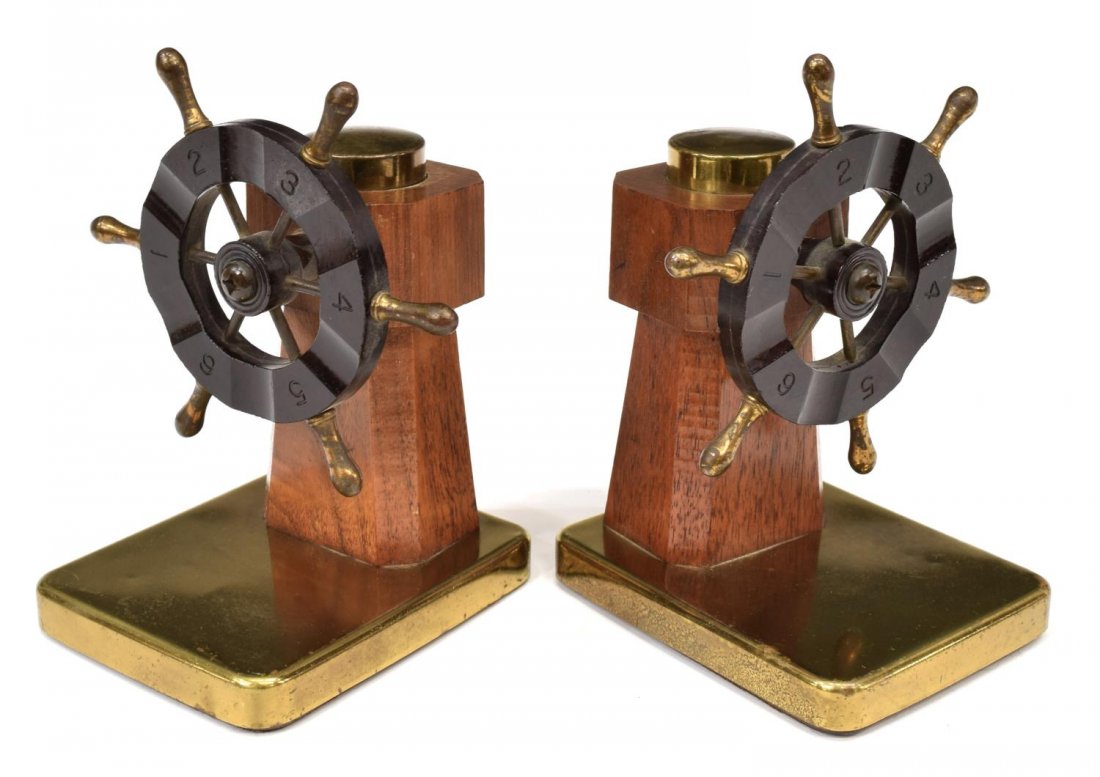 (2) CHASE SHIP'S WHEEL BAKELITE & BRASS BOOKENDS: (pair) Chase ship's wheel form bakelite, wooden and brass bookends, makers mark on back of base lower right, 6.25"h, 4.75"w, 4.25"d; 1.75lbs total Start Price: $50.00