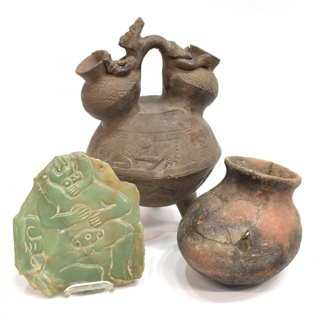 (3) CENTRAL AMERICAN EARTHENWARE & CARVED JADE: (lot of 3) South American earthenware pottery and jade, comprising: (1) double spout pitcher/moon jar with figure form handle, fracture and restoration to one foot, loss to bottom, loss at one spout, 