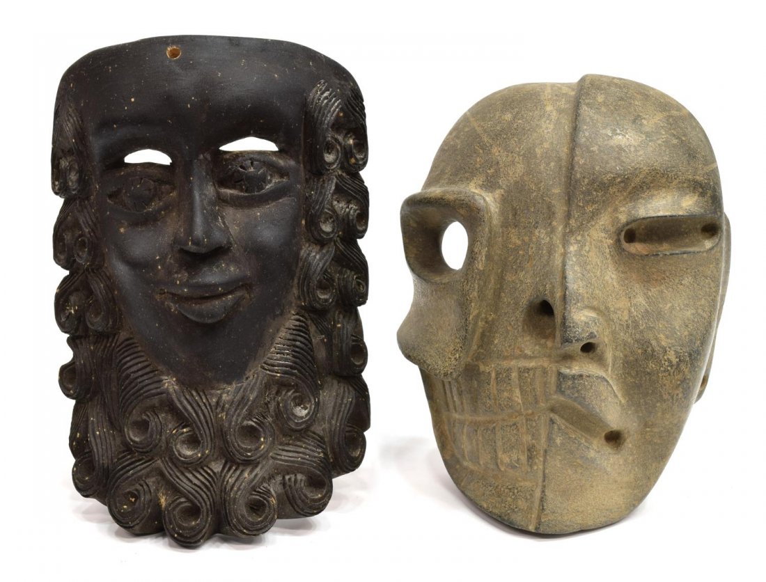 (2) CARVED STONE & WOOD MASKS: (lot of 2) Carved masks, possibly 20th c., (1) carved stone stylized two faced mask, 9"h, 7"w, 4.25"d; (1) carved wooden mask, bearded man, eye slits at brow line, 10.5"h, 7"w, 3.5"d' 5.75lbs total St