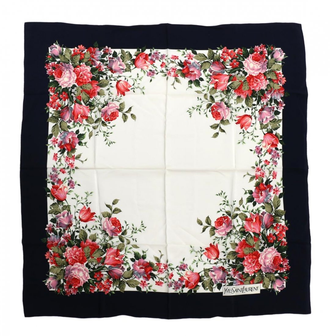 YVES SAINT LAURENT FLORAL SILK SCARF: Yves Saint Laurent silk scarf, red and pink flowers on a white ground with navy blue border, scarf approx: 30.5"l, 30.75"w, .25lbs Start Price: $60.00