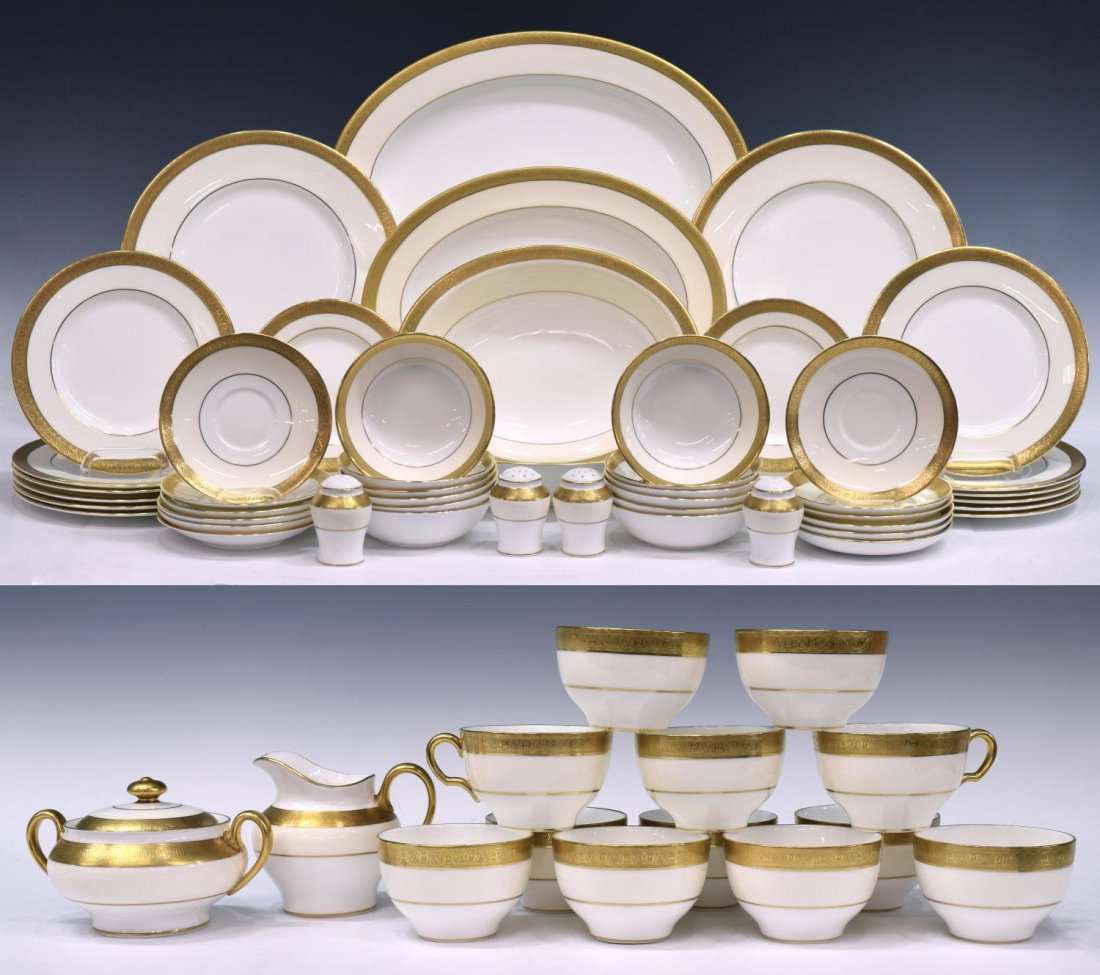 (82) MINTON 'BUCKINGHAM' PATTERN CHINA SET: (lot of 82) English Minton bone china dinner service, 20th c., in the "Buckingham" pattern, each having incised gilt rims, cream tone band surrounding white center, comprising: (2) oval serving platte