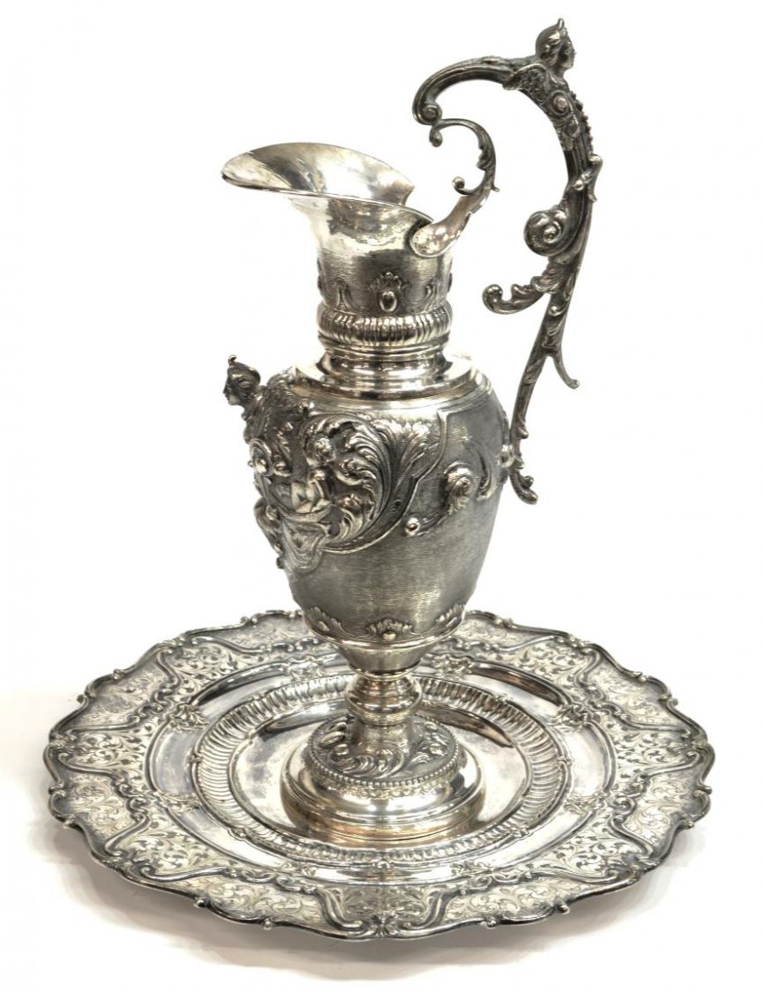 (2) ITALIAN 800 SILVER FIGURAL EWER & UNDERPLATE: (set of 2) Italian 800 silver ewer and underplate, hallmarks as pictured: (1) large ewer, a winged demi-figure on the foliated handle, hammered spout above raised bands, a textured ground on the body 