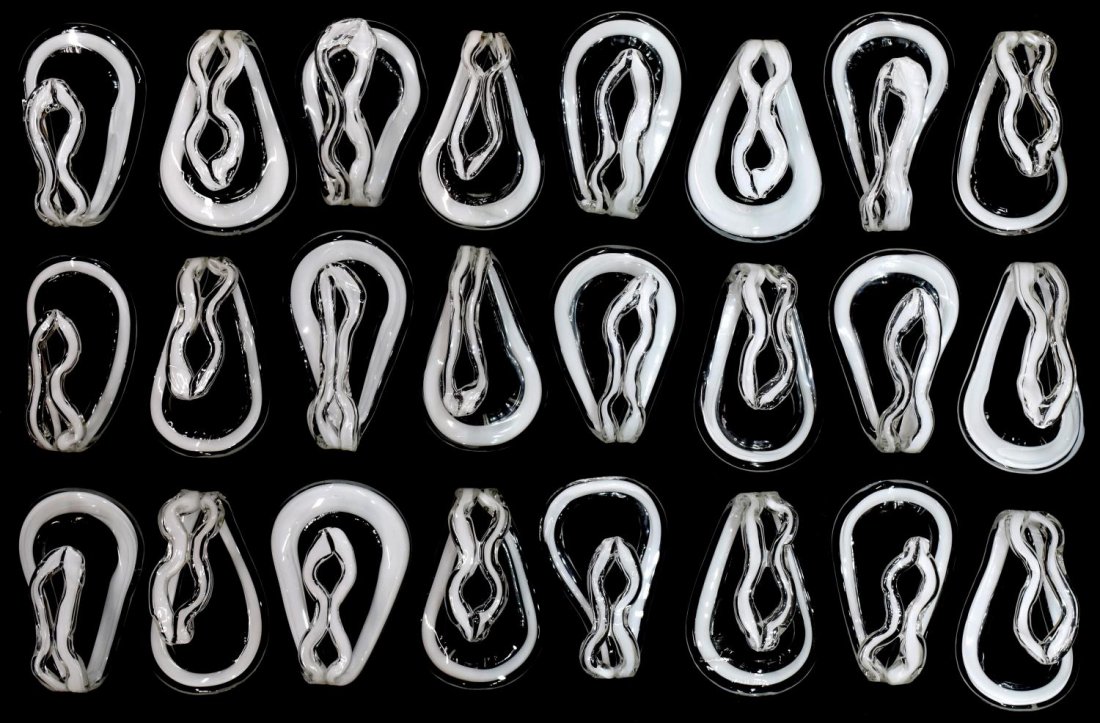 (24) ITALIAN MODERN ART GLASS HOOKS, 20TH C.: (lot of 24) Italian modern art glass hooks, 20th c., white and clear glass shaped hooks, some with minor chips to top of hook, approx. 5.75"h, 3.25"w, 8.5lbs