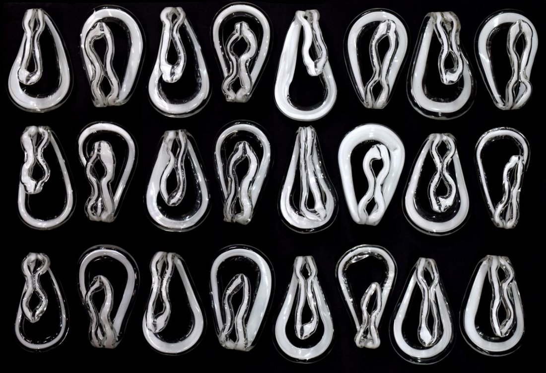 (24) ITALIAN MODERN ART GLASS HOOKS, 20TH C: (lot of 24) Italian modern art glass hooks, 20th c., white and clear glass shaped hooks, some with minor chips to top of hook, approx. 5.75"h, 3.25"w, 8.5lbs total Start Price: $100.00