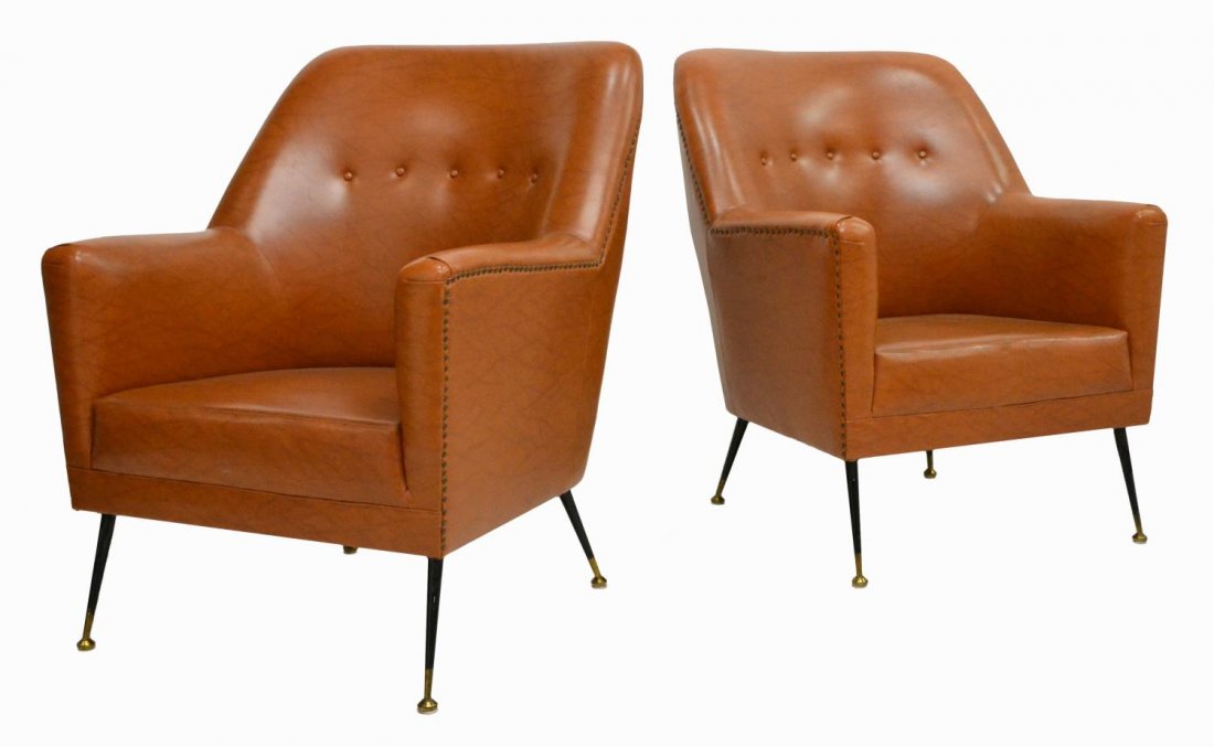 (2) ITALIAN MID-CENTURY FAUX LEATHER ARMCHAIRS: Italian mid-century modern armchairs, c. 1950s, upholstered in brown faux leather, accented by nail head trim, rising on black and brass tapered legs, 38"h, 30.5"w, 29"d Start Price: $600.00