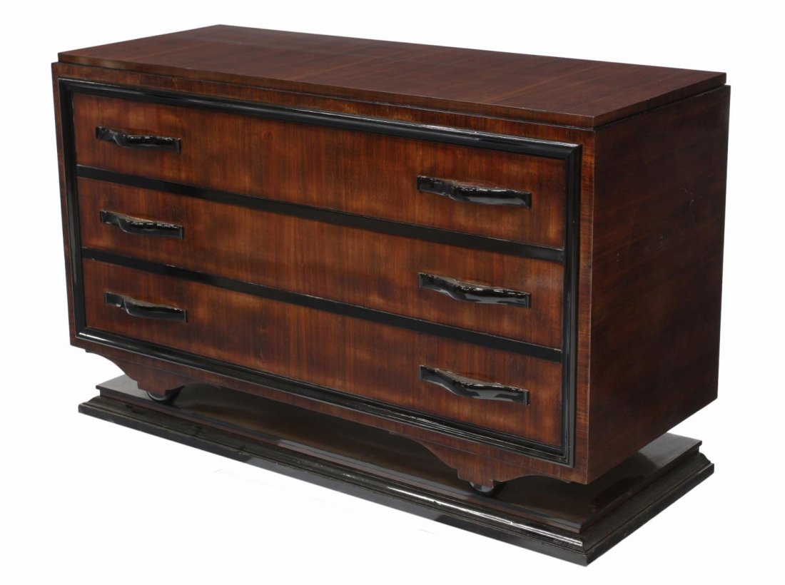 ITALIAN ART DECO MAHOGANY COMMODE, 1930'S: Italian Art Deco mahogany commode, 1930's, a recent gloss finish, ebonized trim and pulls, three drawers all rising on a platform base, 34.25"h, 55"w, 22.25"d Start Price: $250.00