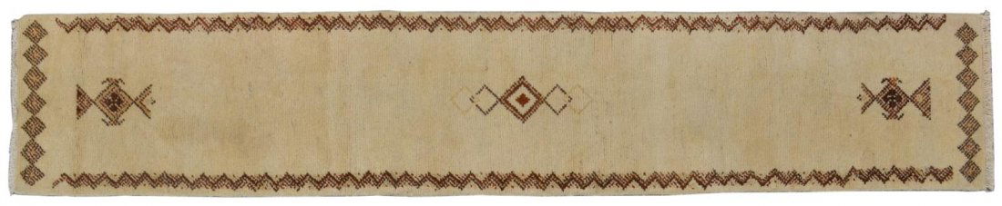HAND TIED WOOL GABBEH RUNNER, 10'4"x1'10.5": Hand tied Gabbeh wool runner, executed in brown tones centered with diamond shaped designs, some stains as pictured, 10'4"l, 1'10.5"w (inclusive of fringe) Start Price: $100.00