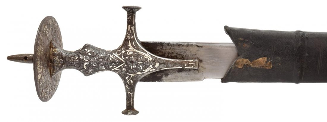 INDO-PERSIAN 18TH C. SWORD, SILVER AT HANDLE: Indo-Persian sword, believed to be 18th c, finely worked handle, silver inlay at handle and pommel, black leather scabbard, blade measured on curve: 31.5", total: 2.0 lbs Start Price: $100.00