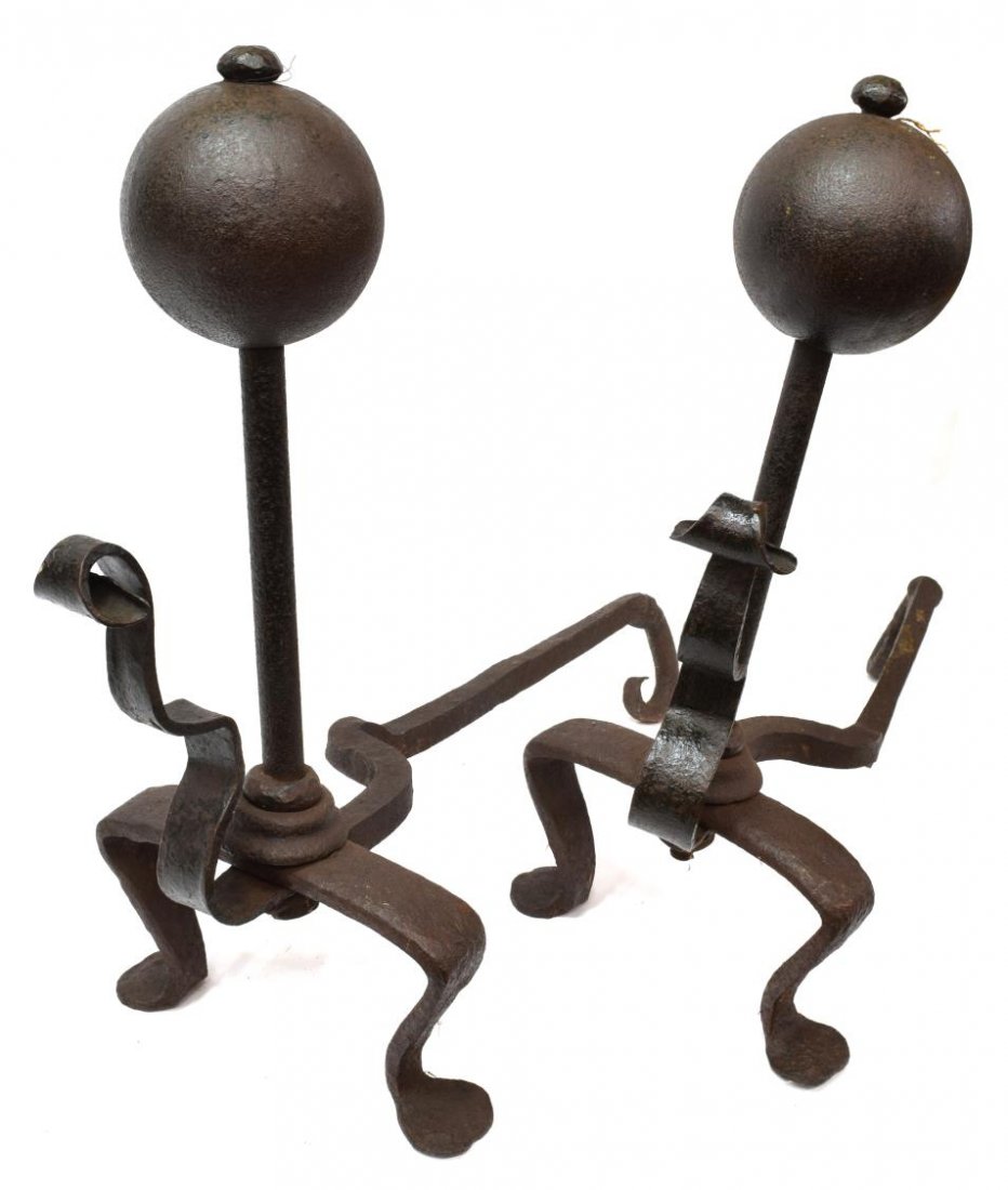 LARGE ANTIQUE IRON BALL TOPPED ANDIRONS: (pair) Black iron andirons, 19th c., having large ball form knobs above plain posts, with ribbon form ornamentation, each rising on two bent legs, 27"h, 28"d, 60lbs total *Provenance: Estate of Howard