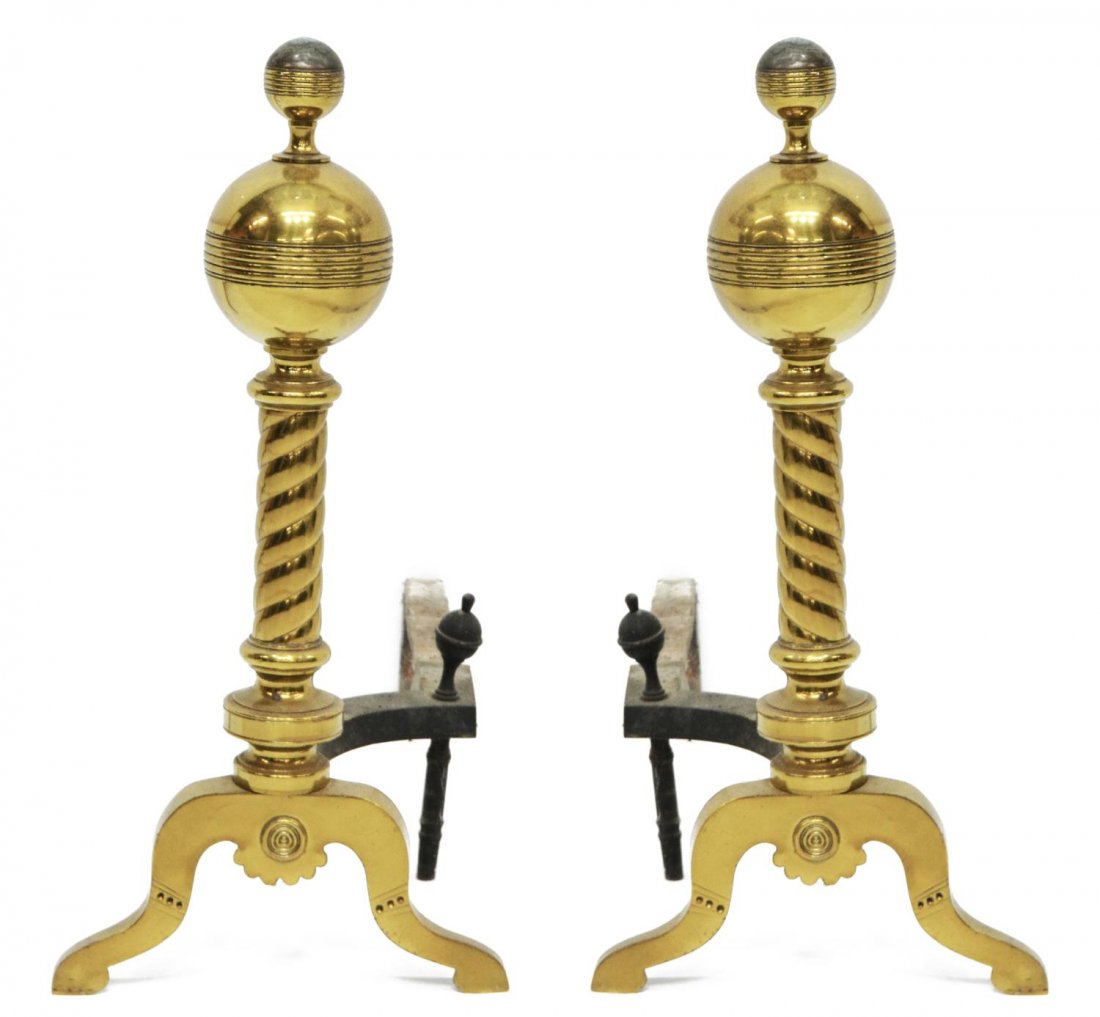 (2) ANTIQUE GILT BRASS & IRON CHENETS: (pair) Gilt brass and iron chenets, 20th c., each having brass globular top with round finials, twisted and turned standard rising on two shaped feet, iron supports, oxidation, approx 21"h, 10"w, 20"d