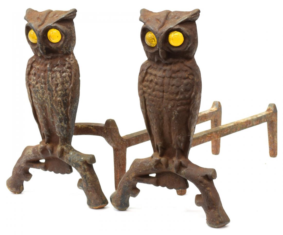 (2) CAST IRON OWL FORM GLASS EYE ANDIRONS: (pair) Owl cast iron andirons with yellow glass eyes, 12.5"h, 8"w, 18"d, 12.5lbs total Start Price: $100.00