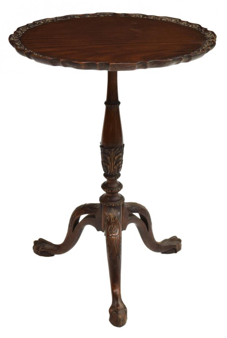 CHIPPENDALE STYLE CARVED MAHOGANY TILT-TOP TABLE: Chippendale style carved mahogany tilt-top table, circular top with scalloped rim, acanthus carved standard, rising on three legs, ending in ball and talon feet, restoration to base, approx 28"h, 20.5
