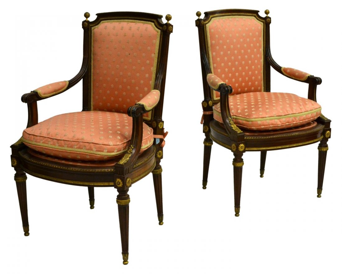 (2) LOUIS XVI STYLE CHAISE A LA REINE CHAIRS: (pair) Louis XVI style "chaise a la Reine" parcel gilt arm chairs, 19th c., having flat backs with acanthus molding, rosettes and gilt bronze pomegranate finials, padded arms on curved supports decora