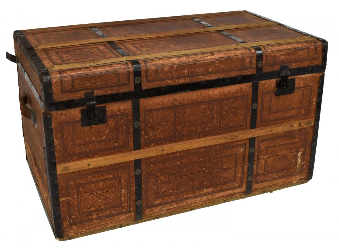 VICTORIAN METAL BOUND STEAMER TRUNK: Victorian steamer trunk having geometric printed paper exterior with metal bands across lid and base, worn leather handles to sides, marked "GMD Ingman" on side, paper lined interior, loss and overall