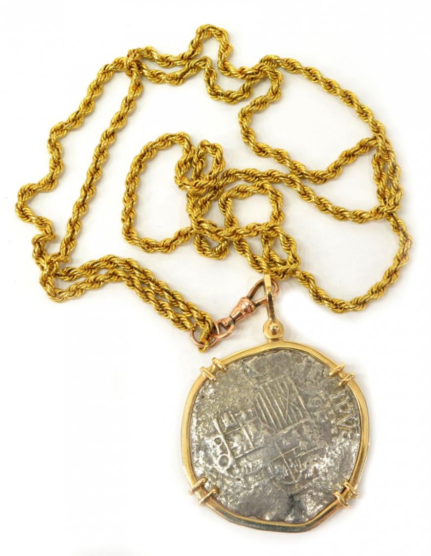 ESTATE SPANISH REALE COB COIN PENDANT & GOLD CHAIN: Ladies estate 14kt yellow gold & silver Spanish 8 Reales cob coin recovered from the Nuestra Senora De Atocha, now set in a gold bail and fashioned as a pendant, the silver coin accompanied by Treasur