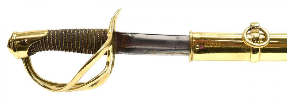 FRENCH MODEL 1822 CAVALRY SABER: French Model 1822 cavalry saber, engraved and dated at spine with further notations and 1878 date, blade 36.5"l, numbered at hilt basket 2799, all brass appears as re-plated or polished, faint marks o