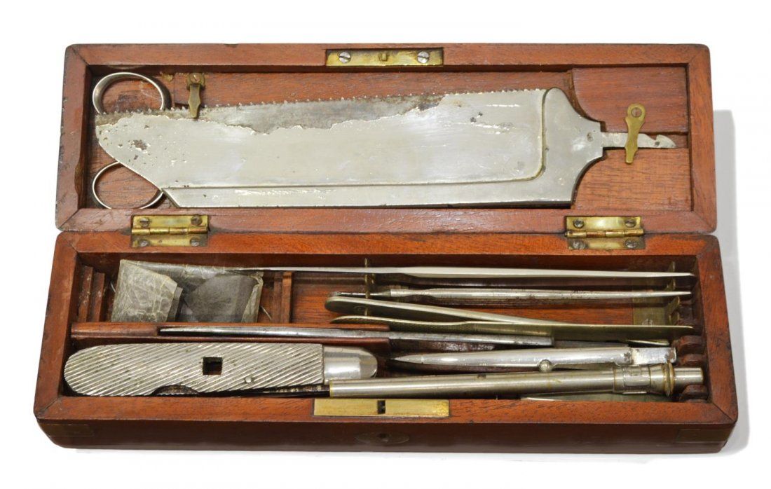 BRASS & MAHOGANY BOXED SURGEONS KIT, SAW: Antique surgery tools, 19th/20th c., housed in a brass bound mahogany box, tools include saw, clamp, scalpels and more, several marked London, box: 1.7/8"h, 10.1/8"w, 2.75"d, 1.75lbs Start Price: $100