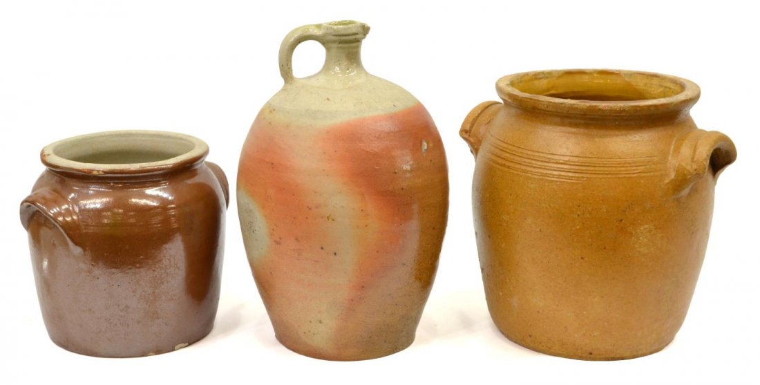 (3) GROUP OF FRENCH PROVINCIAL EARTHENWARE JUGS: (lot of 3) Group of French Provincial earthenware jugs, comprising: (1) partial glaze wine jug with single handle, drilled hole to base, 12.5"h; (1) short brown glaze confit jar, 7.5"h; (1) yellow gla