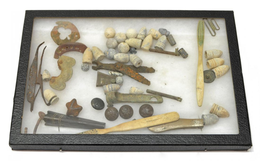 COLLECTION OF U.S. CIVIL WAR DUG ITEMS, BULLETS: Collection of dug U.S. Civil War items including more than 25 bullets of various types and sizes, uniform buttons, two toothbrushes one marked "The Economic", percussion caps, other metallic items, al