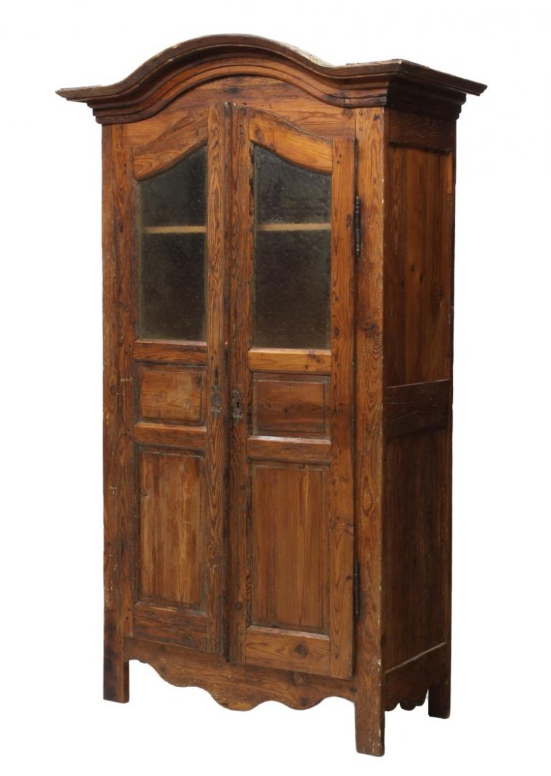 FRENCH COUNTRY KITCHEN CABINET: French country kitchen cabinet, early 19th c., having an arched cornice over two doors, the upper part having frosted glass over lower raised panels, rising on straight supports, 85.75"h, 49.5"w, 24"d