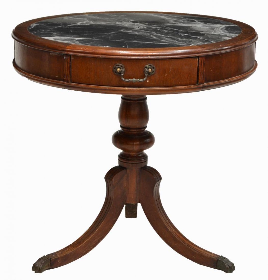 MAHOGANY MARBLE TOP DRUM TABLE: Mahogany drum table, 20th c., the circular top with inset marble over a single frieze drawer, rising on a turned support with three outswept supports on brass claw feet, restoration to foot, 27.25"h, 