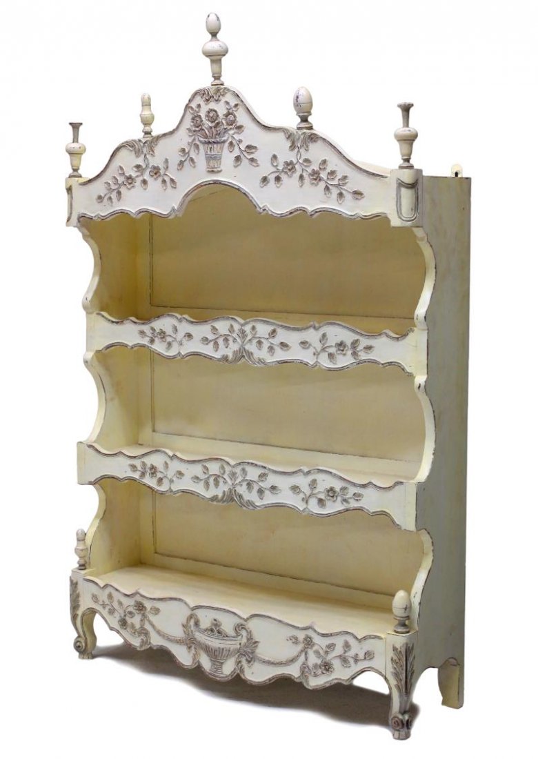 FRENCH HANGING CARVED DISPLAY SHELVES: French painted hanging display etagere, Provence, 19th c., the arched cornice and three shelf skirts accented with applied foliate decoration, short scrolled feet, hangers at back, 58.5"h, 37"w, 11.25