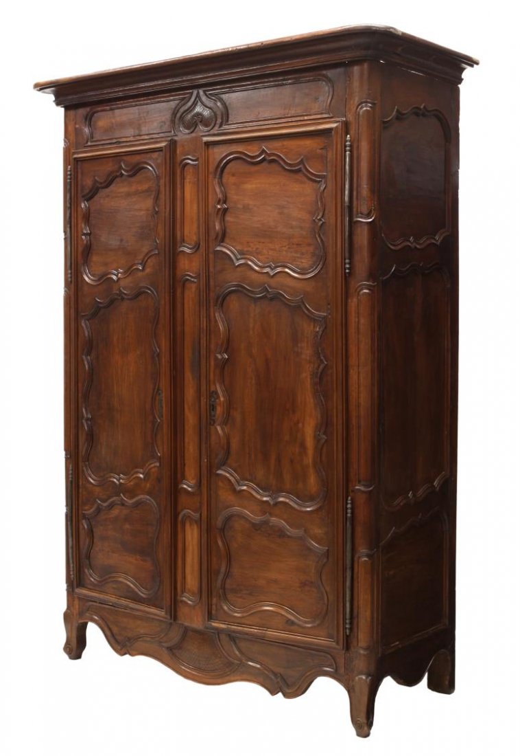 FRENCH PROVINCIAL LOUIS XV ARMOIRE, 18TH C.: French provincial Louis XV armoire, 18th c., a stepped cornice over two doors having large exterior hinges and shaped panels opening to the shelved interior, rising on short cabriole legs, 96"h, 68.25