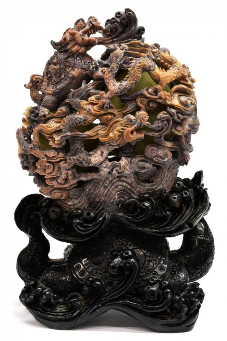 CHINESE CARVED OPENWORK SOAPSTONE DRAGON TURTLE: Ornate Chinese soapstone figural carving, pierced openwork outter carving depicting a dragon turtle above several sinuous dragons in pursuit of a jewel, visible to the interior are two celadon color e
