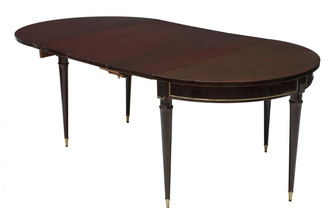 CONTINENTAL MAHOGANY EXTENDABLE FOLDING TABLE: Continental mahogany folding table, 20th c., rising on four tapered brass capped feet, extendable, surface scratches to table top and leaves, folded: 30"h, 43.5"l, 21.25"w, extended: 80.5"l Start Pric
