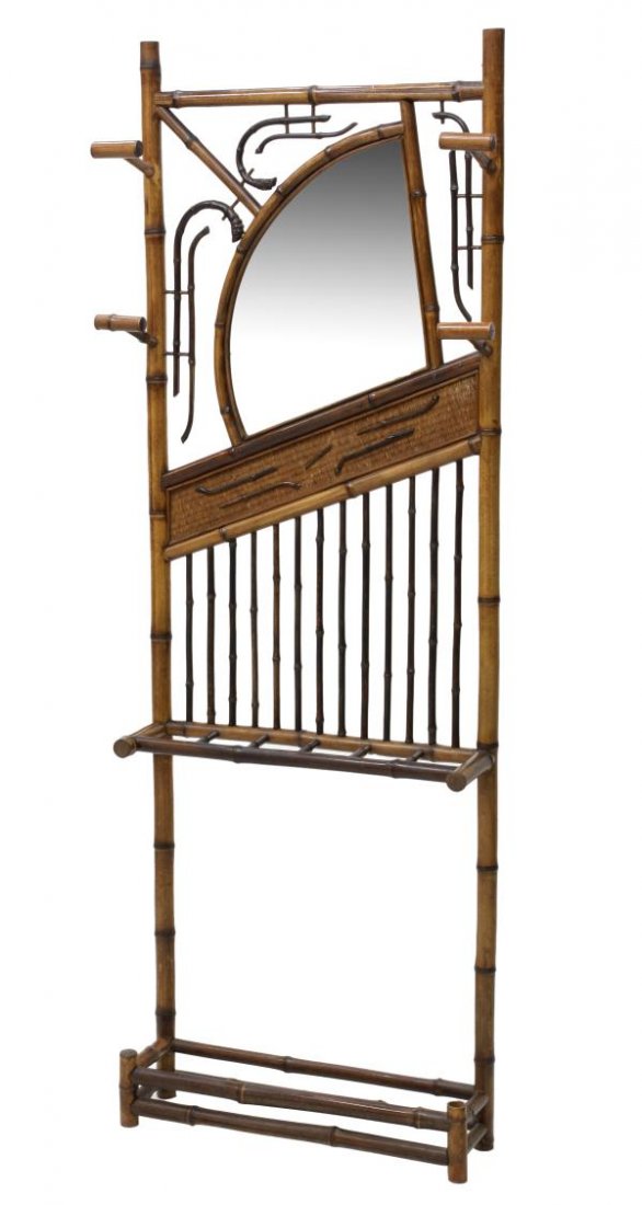 FRENCH ART DECO BAMBOO MIRRORED HALL TREE: French Art Deco bamboo hall tree, 1920's, having a shaped beveled mirror, coat hooks and lower umbrella rack, set on bamboo supports, 75"h, 28"w, 7"d *Provenance: Dreyfus Antiques, Austin, Texas* Star