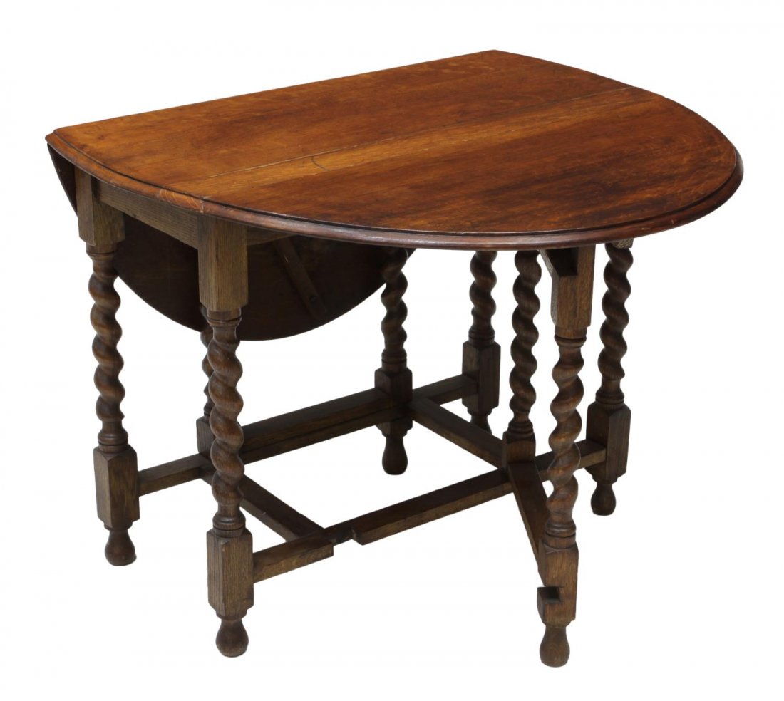 ENGLISH OAK DROP LEAF TABLE, C. 1900: English oak gate leg drop leaf table, c. 1900, rising on twist and block supports with turned feet, table with leaves raised: 48"l, leaves down: 28.5"h, 17.5"w, 36"d *Provenance: Dreyfus Antiques, Aus